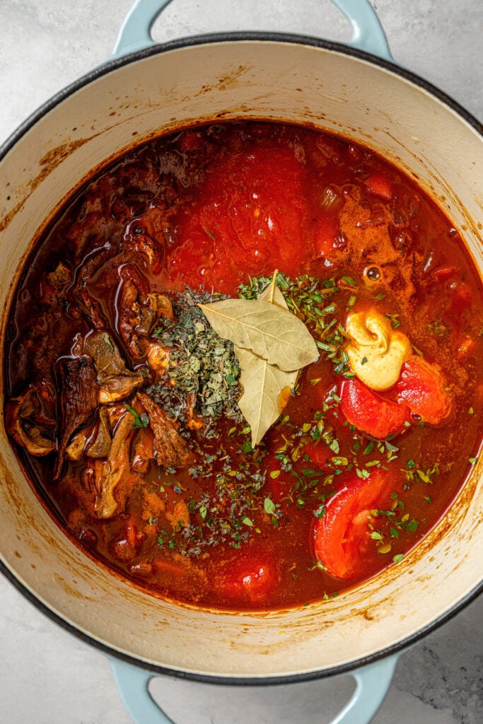 Adding the herbs to the pot.