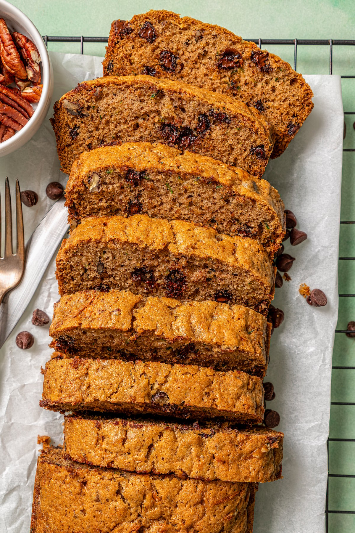 Sliced loaf with fresh zucchini and chocolate chips inside. 